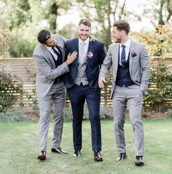Navy lounge suit for the Groom & grey was the choice for the Ushers