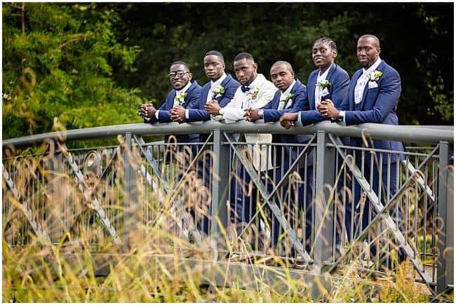 Groom with his contrasting Ushers blue hires suits
