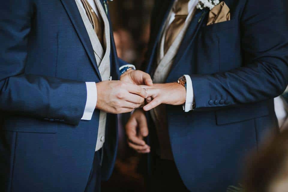 Exchanging rings, the LGBTQ wedding of Charlie and Joe