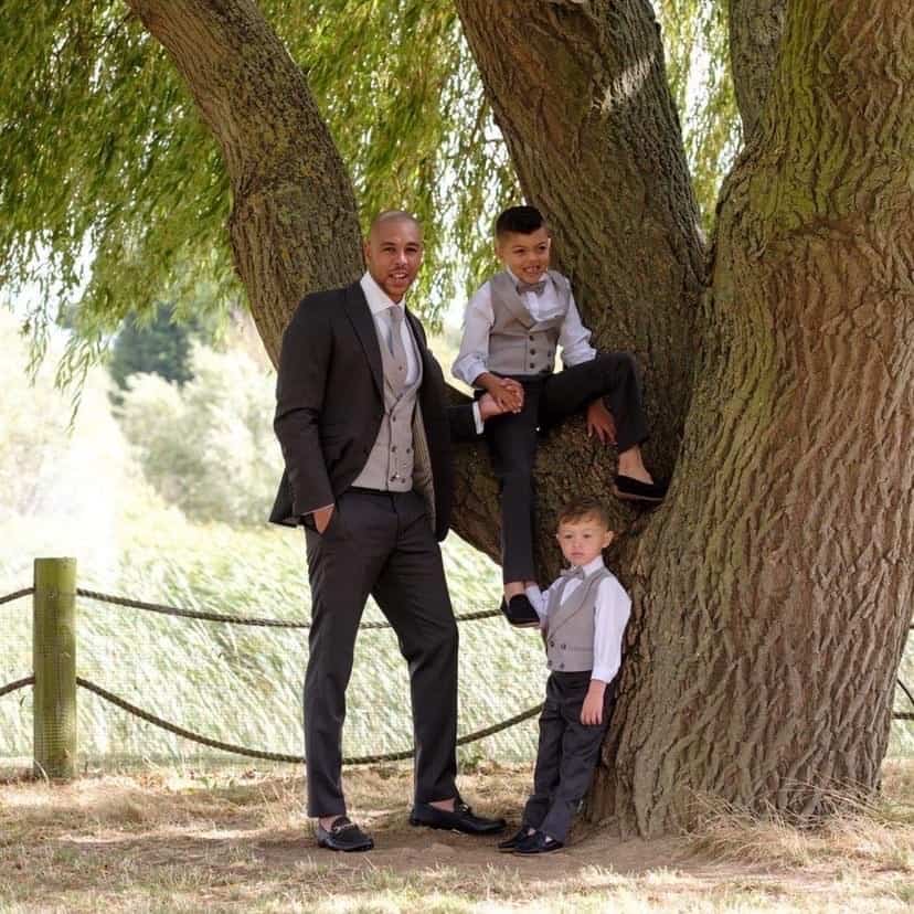 Classic grey herringbone lounge suit with matching waistcoats for the page boys