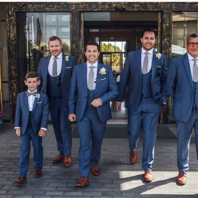 Mr Penton with his matching page boys steel blue suit