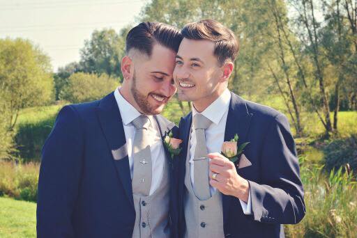 Stace & Craig are wearing our matching navy lounge suits with our Ascot grey scoop waistcoats and matching ties