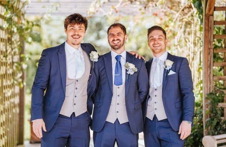 Royal blue suits with grey scoop waistcoats. Groom, Mr Dickens wore a royal blue tie rest sky blue to match the Bridesmaids