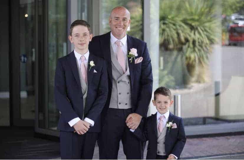 Mr Smith & his sons in their navy lounge hire suits
