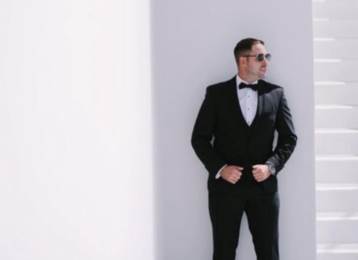 Mr Abella in his black tie wedding suit hire